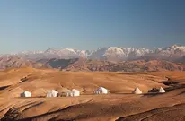 Luxury tents and dramatic landscapes of the Agafay Desert, easily reached by direct airport transfer from Marrakech