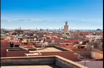 The Marrakech Medina Skyline buildings of the bustling souks and architecture, accessible for a transfer to RAK Airport